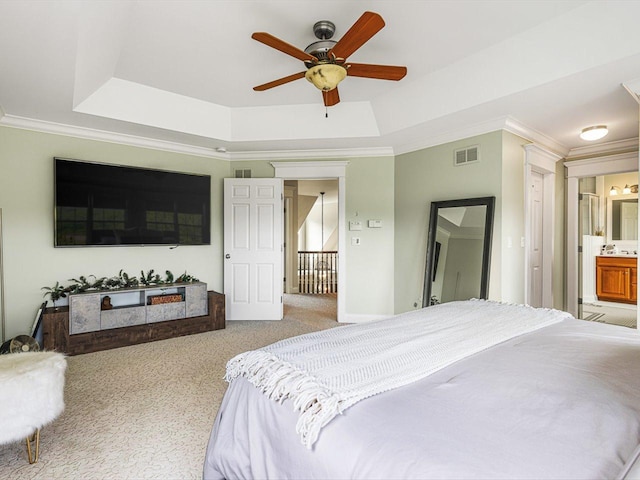 2207 N Elmkirk Pkwy N, Mchenry, IL 60051 - bedroom featuring a tray ceiling, carpet, ornamental molding, ensuite bath, and ceiling fan