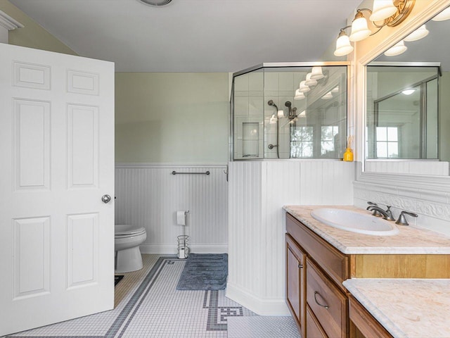 2207 N Elmkirk Pkwy N, Mchenry, IL 60051 - full bathroom with vanity, tiled shower, a wainscoted wall, and tile patterned flooring