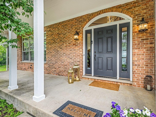 2207 N Elmkirk Pkwy N, Mchenry, IL 60051 - entrance to property featuring brick siding and a porch