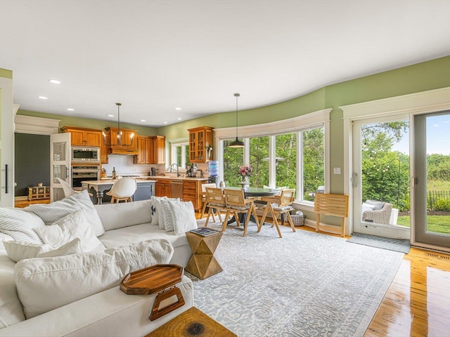 2207 N Elmkirk Pkwy N, Mchenry, IL 60051 - living room with light wood-style flooring and recessed lighting