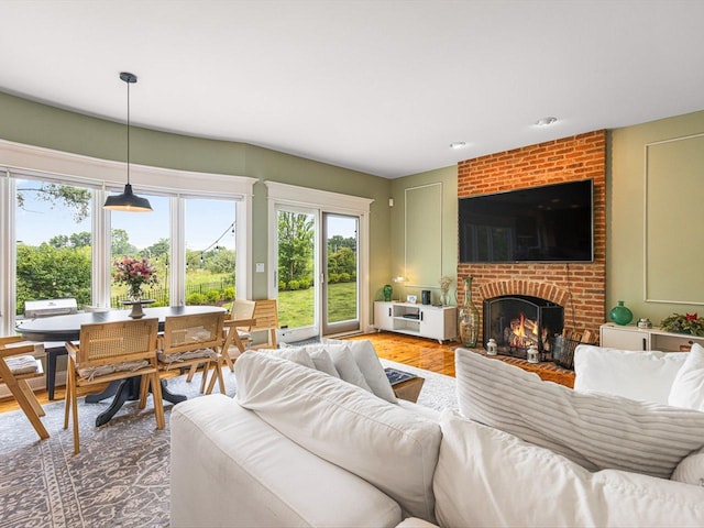 2207 N Elmkirk Pkwy N, Mchenry, IL 60051 - living room featuring a fireplace and light wood finished floors