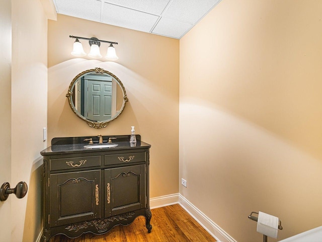 2207 N Elmkirk Pkwy N, Mchenry, IL 60051 - bathroom featuring vanity, wood finished floors, and a paneled ceiling