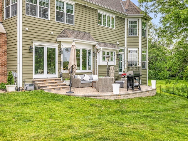 2207 N Elmkirk Pkwy N, Mchenry, IL 60051 - rear view of house featuring entry steps, a patio, a lawn, and outdoor lounge area