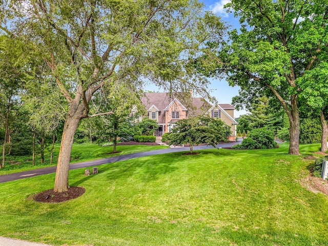 2207 N Elmkirk Pkwy N, Mchenry, IL 60051 - view of front facade featuring a front lawn and driveway