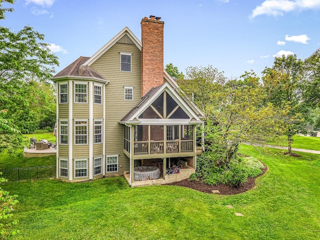 2207 N Elmkirk Pkwy N, Mchenry, IL 60051 - back of house featuring a chimney and a sunroom