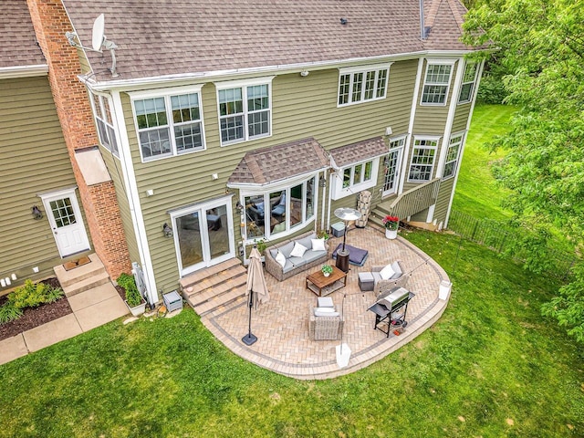 2207 N Elmkirk Pkwy N, Mchenry, IL 60051 - back of house with entry steps, a patio area, an outdoor hangout area, and roof with shingles
