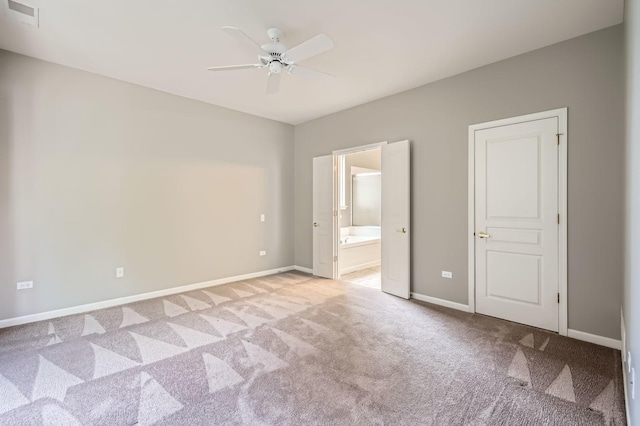 13490 Honeysuckle Dr, Huntley, IL 60142 - unfurnished bedroom with light colored carpet, ensuite bath, and ceiling fan