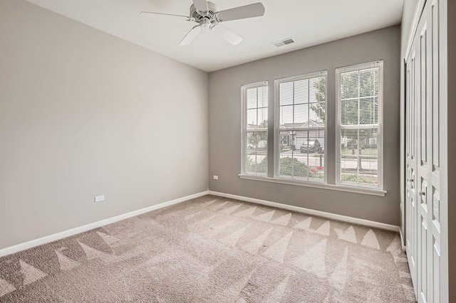 13490 Honeysuckle Dr, Huntley, IL 60142 - empty room featuring light colored carpet and a ceiling fan