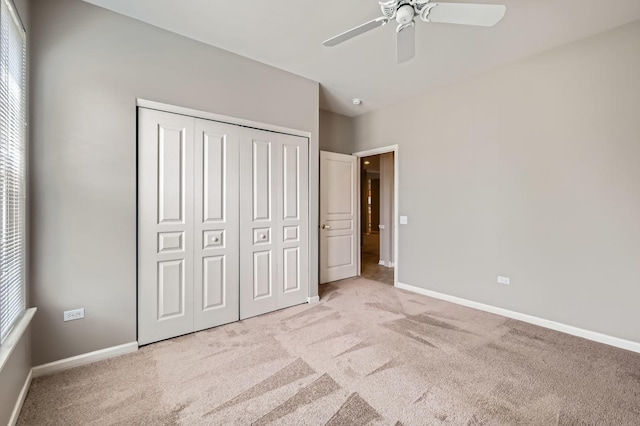 13490 Honeysuckle Dr, Huntley, IL 60142 - unfurnished bedroom featuring carpet flooring, a closet, a ceiling fan, and multiple windows