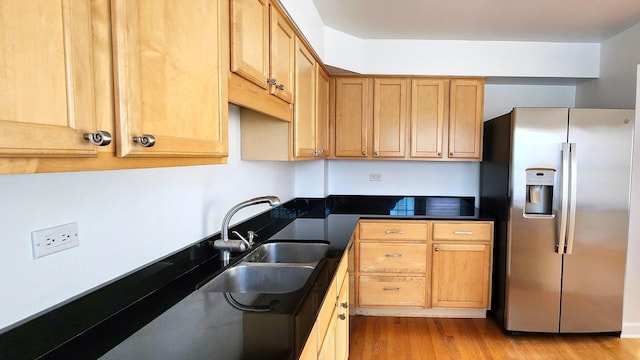 5448 N Washtenaw Ave, Chicago, IL 60625 - kitchen featuring stainless steel refrigerator with ice dispenser, wood finished floors, and dark countertops