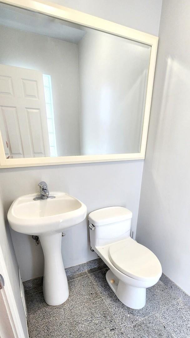 5448 N Washtenaw Ave, Chicago, IL 60625 - half bath featuring toilet and a sink