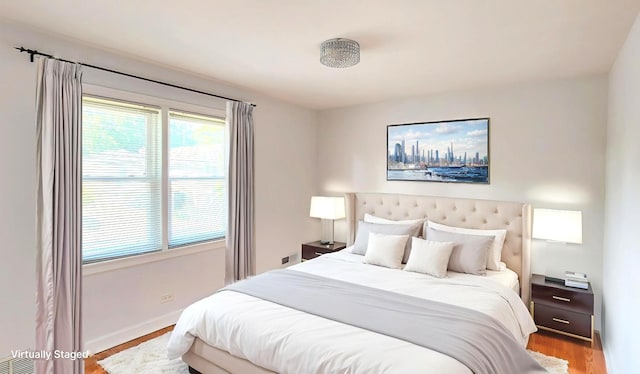 5448 N Washtenaw Ave, Chicago, IL 60625 - bedroom with wood finished floors and baseboards