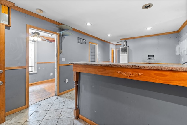 5212 S Honore St, Chicago, IL 60609 - kitchen with crown molding, recessed lighting, light countertops, light tile patterned floors, and ceiling fan