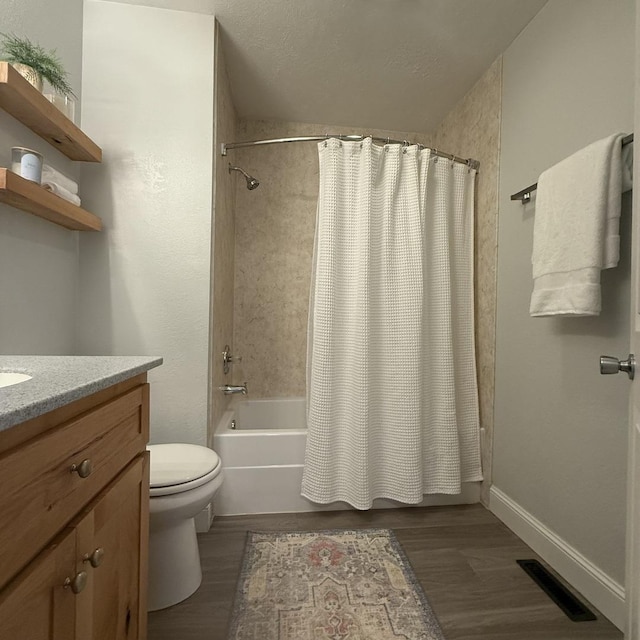 1508 Hancock Dr Unit 1, Normal, IL 61761 - full bath featuring shower / bath combo with shower curtain, vanity, and wood finished floors