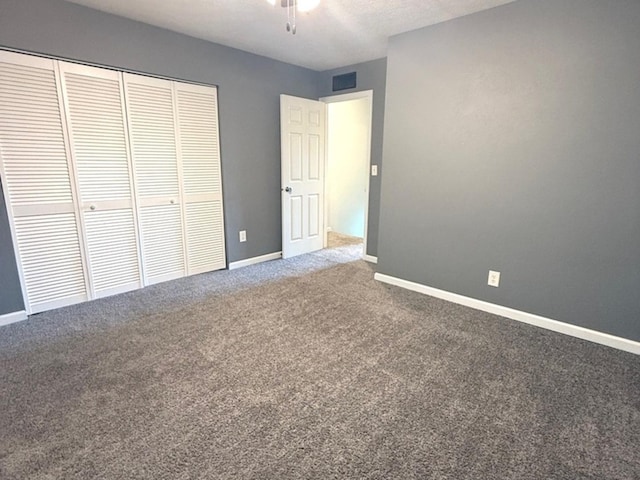 1508 Hancock Dr Unit 1, Normal, IL 61761 - unfurnished bedroom with carpet flooring, a closet, and a ceiling fan