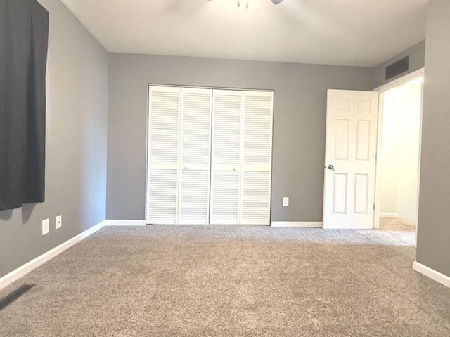 1508 Hancock Dr Unit 1, Normal, IL 61761 - unfurnished bedroom featuring carpet, a closet, and ceiling fan