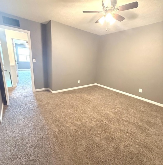 1508 Hancock Dr Unit 1, Normal, IL 61761 - spare room with carpet flooring and a ceiling fan
