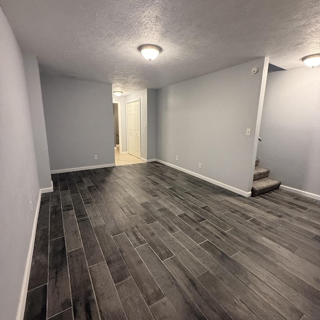 1508 Hancock Dr Unit 1, Normal, IL 61761 - empty room featuring a textured ceiling, dark wood finished floors, stairs, and a smoke detector