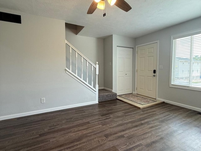1508 Hancock Dr Unit 1, Normal, IL 61761 - foyer entrance featuring wood finished floors, stairway, a ceiling fan, and a textured ceiling