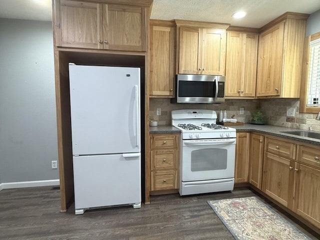 1508 Hancock Dr Unit 1, Normal, IL 61761 - kitchen with white appliances, dark wood finished floors, backsplash, recessed lighting, and light brown cabinets