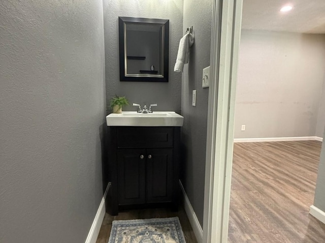 1508 Hancock Dr Unit 1, Normal, IL 61761 - bathroom with wood finished floors, vanity, and recessed lighting