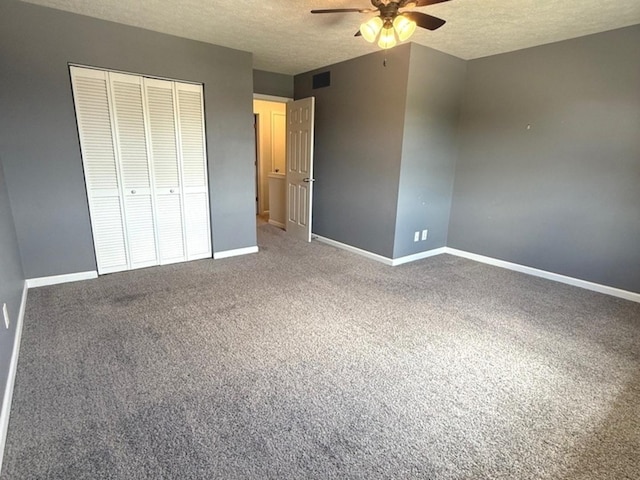 1508 Hancock Dr Unit 1, Normal, IL 61761 - unfurnished bedroom featuring a textured ceiling, a closet, carpet flooring, and a ceiling fan