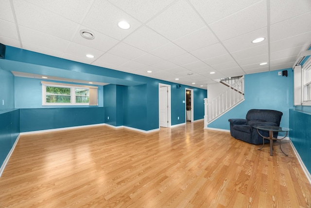 2110 Sanford Ave, New Lenox, IL 60451 - unfurnished living room featuring stairs, light wood-style flooring, recessed lighting, and a paneled ceiling