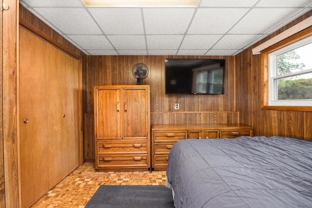 2110 Sanford Ave, New Lenox, IL 60451 - bedroom featuring wood walls, a drop ceiling, and a closet