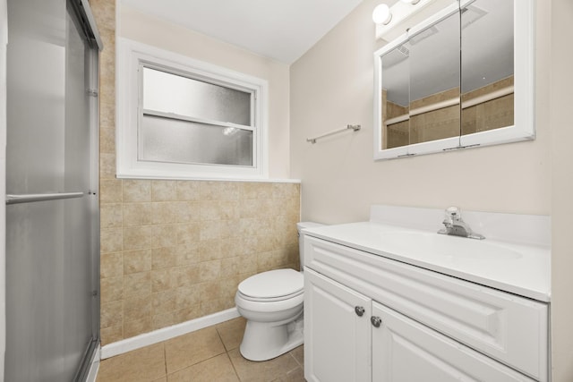 2110 Sanford Ave, New Lenox, IL 60451 - bathroom with a shower with door, vanity, tile walls, tile patterned floors, and a wainscoted wall