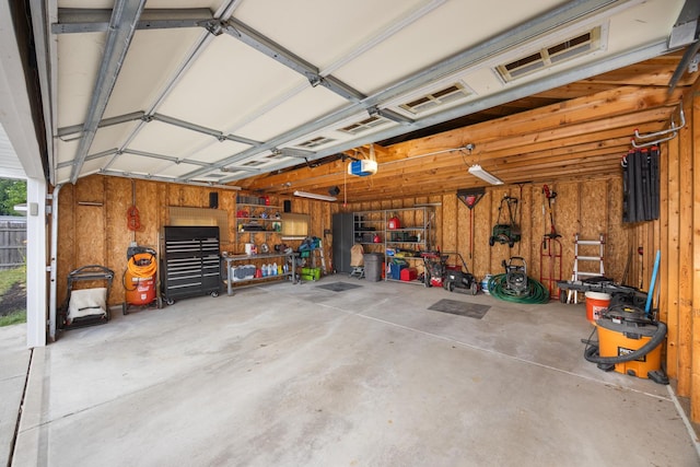 2110 Sanford Ave, New Lenox, IL 60451 - garage with a garage door opener and wood walls