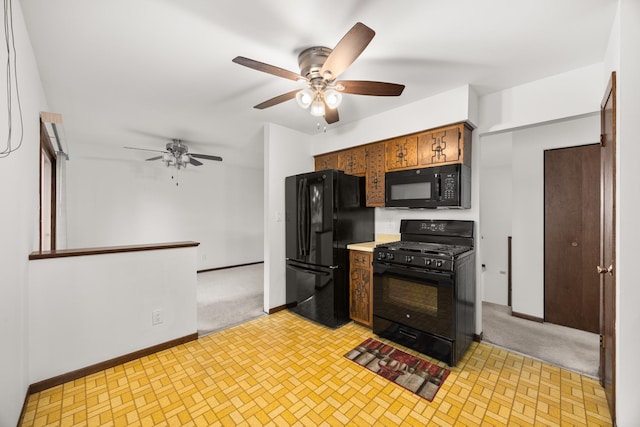 2110 Sanford Ave, New Lenox, IL 60451 - kitchen with black appliances, a ceiling fan, and light countertops