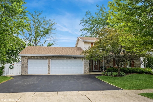 920 Barnside Rd, New Lenox, IL 60451 - view of front facade featuring asphalt driveway, brick siding, an attached garage, and a shingled roof