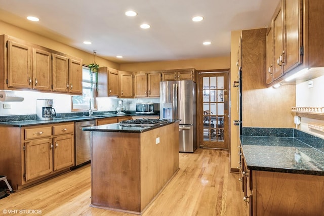 920 Barnside Rd, New Lenox, IL 60451 - kitchen featuring appliances with stainless steel finishes, light wood-type flooring, a kitchen island, dark stone countertops, and recessed lighting