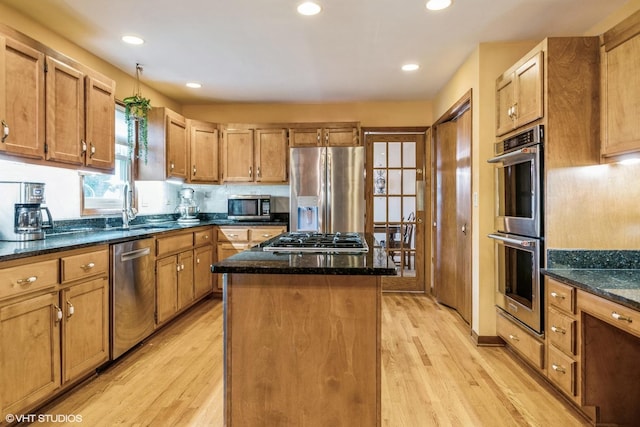 920 Barnside Rd, New Lenox, IL 60451 - kitchen featuring appliances with stainless steel finishes, a kitchen island, light wood-type flooring, dark stone countertops, and recessed lighting