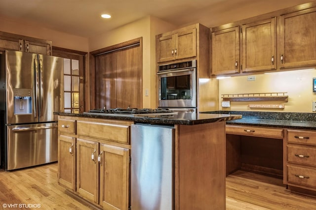 920 Barnside Rd, New Lenox, IL 60451 - kitchen with stainless steel appliances, light wood finished floors, dark stone counters, a center island, and recessed lighting