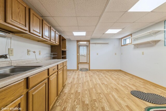 920 Barnside Rd, New Lenox, IL 60451 - kitchen with open shelves, light wood-type flooring, brown cabinets, light countertops, and a paneled ceiling