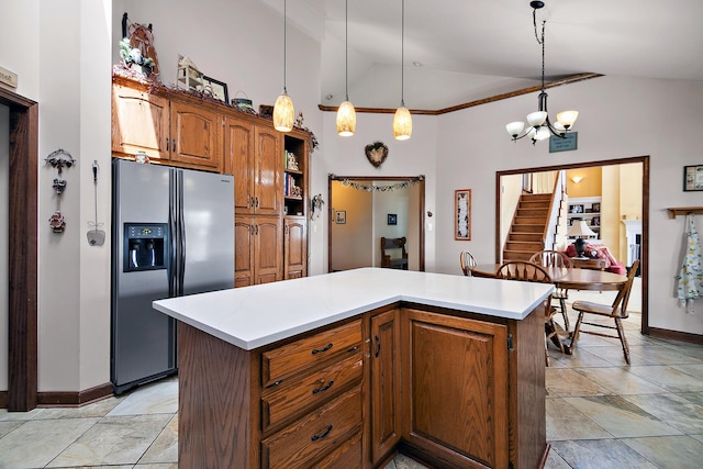4751 N 5500w Rd, Kankakee, IL 60901 - kitchen with stainless steel fridge with ice dispenser, high vaulted ceiling, light countertops, brown cabinets, and hanging light fixtures