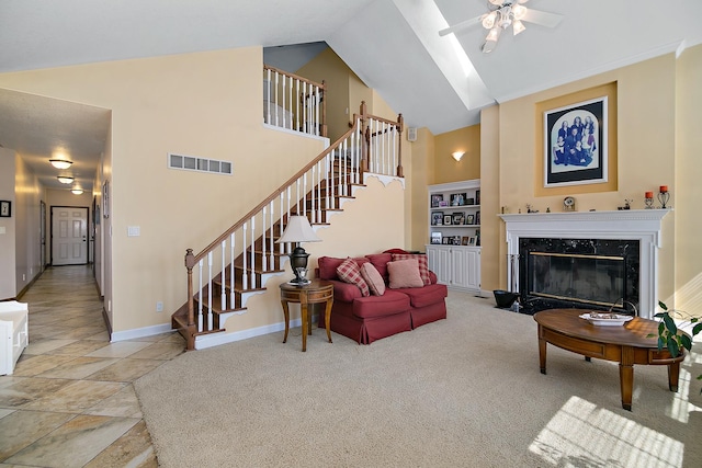 4751 N 5500w Rd, Kankakee, IL 60901 - carpeted living room with a ceiling fan, high vaulted ceiling, stairway, a fireplace, and stone finish flooring
