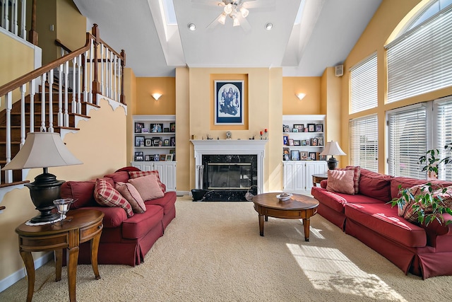 4751 N 5500w Rd, Kankakee, IL 60901 - living room featuring high vaulted ceiling, carpet floors, a ceiling fan, a premium fireplace, and built in shelves