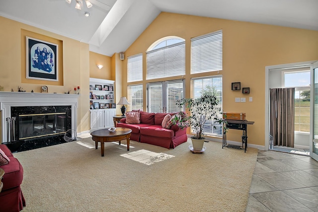 4751 N 5500w Rd, Kankakee, IL 60901 - living room featuring high vaulted ceiling, a high end fireplace, carpet floors, and tile patterned floors