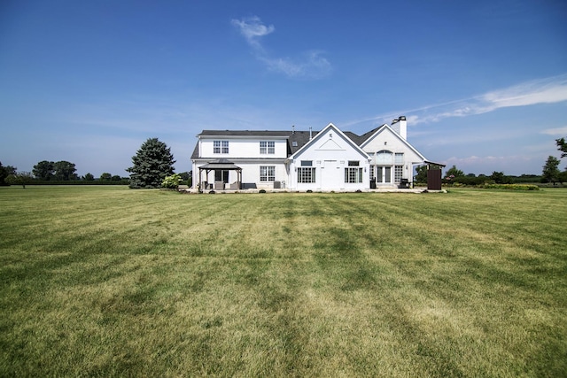 4751 N 5500w Rd, Kankakee, IL 60901 - rear view of house with a lawn and a chimney