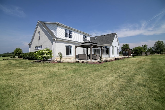 4751 N 5500w Rd, Kankakee, IL 60901 - rear view of house featuring a gazebo, outdoor lounge area, a patio, and a lawn