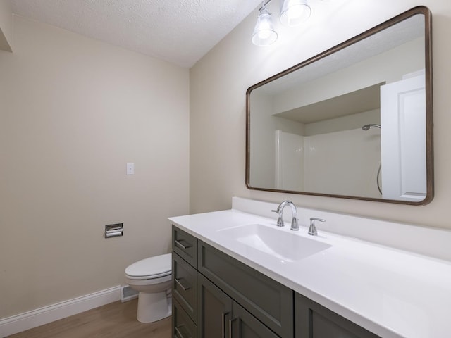 14746 Mercury Ln, Bloomington, IL 61705 - full bathroom with wood finished floors, vanity, and a textured ceiling