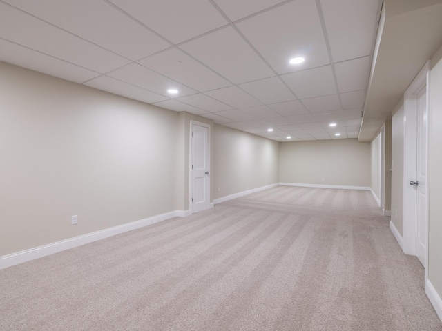 14746 Mercury Ln, Bloomington, IL 61705 - finished basement with light colored carpet, recessed lighting, and a paneled ceiling