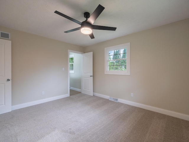 14746 Mercury Ln, Bloomington, IL 61705 - unfurnished bedroom with carpet and a ceiling fan