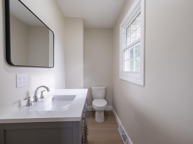 14746 Mercury Ln, Bloomington, IL 61705 - half bathroom featuring wood finished floors and vanity