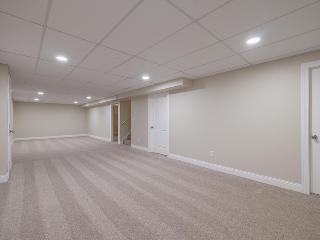14746 Mercury Ln, Bloomington, IL 61705 - finished below grade area with light carpet, recessed lighting, and a paneled ceiling