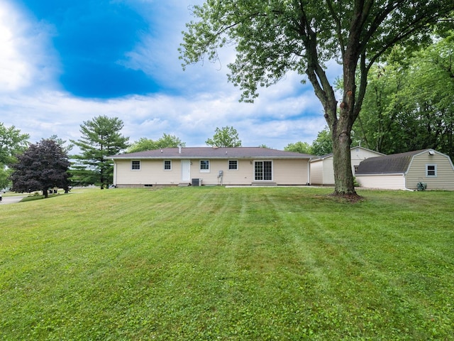 14746 Mercury Ln, Bloomington, IL 61705 - back of house with a yard and an outbuilding