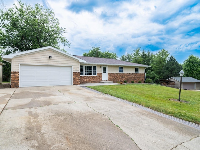 14746 Mercury Ln, Bloomington, IL 61705 - ranch-style home with an attached garage, concrete driveway, brick siding, and a front yard