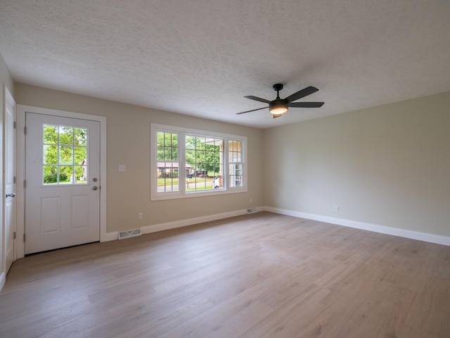 14746 Mercury Ln, Bloomington, IL 61705 - entrance foyer with light wood-style flooring, plenty of natural light, a textured ceiling, and ceiling fan